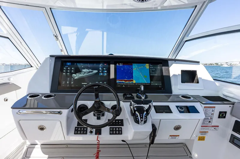 Slide: The Image of Manufacturer Provided Image: Helm of 2025 Everglades 367 CX boat with advanced navigation displays. - 6