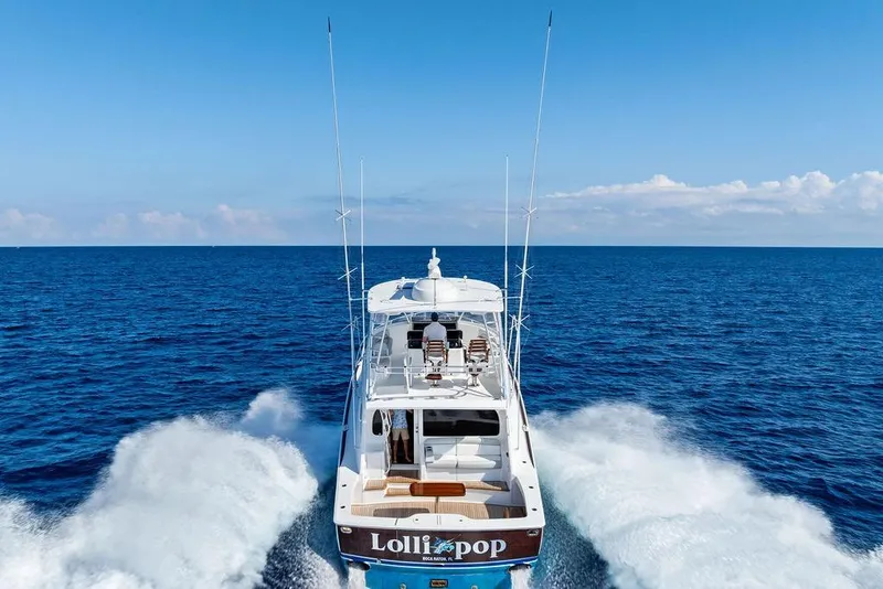 Slide: The Image of 2022 Viking 48 Convertible yacht cruising on open ocean waters. - 10