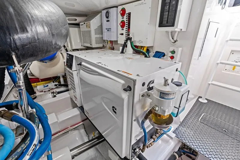Slide: The Image of Engine room of 2022 Viking 48 Convertible yacht with modern equipment and wiring. - 68
