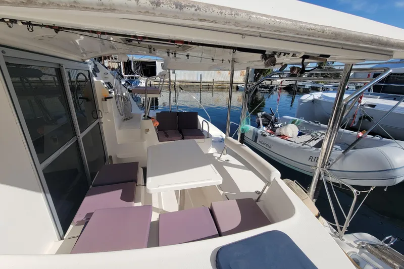 Slide: The Image of 2014 Leopard 39 yacht cockpit with seating and table, docked at marina. - 10