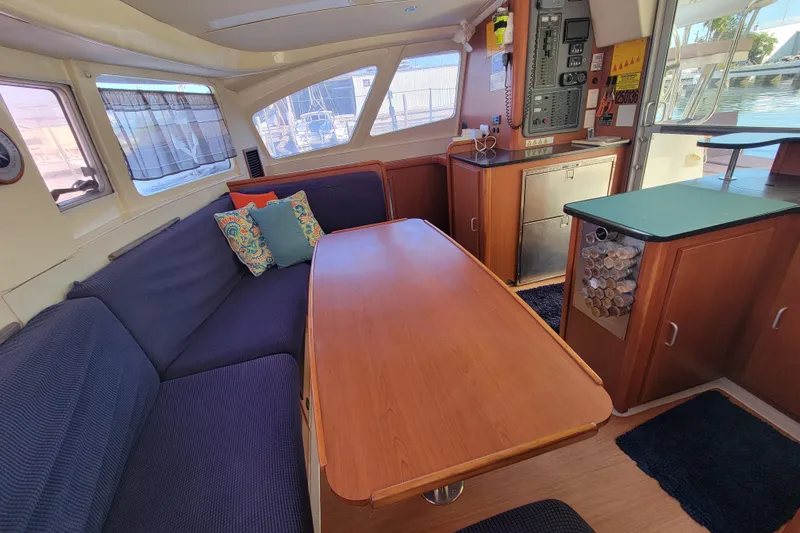 Slide: The Image of Interior of 2014 Leopard 39 yacht with cozy seating and wooden table. - 2