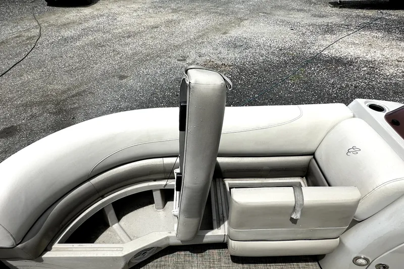 Slide: The Image of 2022 Cypress Cay Seabreeze 232 boat interior with white cushioned seating. - 15