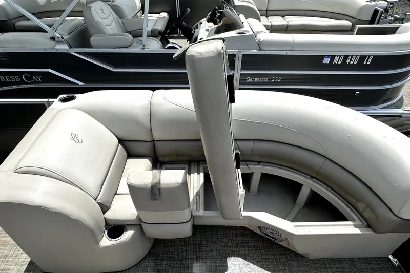 Slide: The Image of 2022 Cypress Cay Seabreeze 232 pontoon boat with luxurious seating and sleek design. - 19