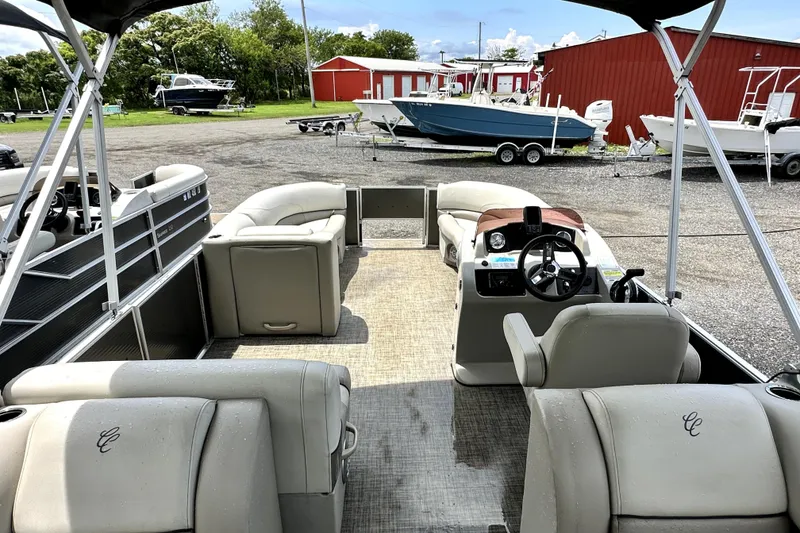 Slide: The Image of 2022 Cypress Cay Seabreeze 232 pontoon boat interior with steering console and seating. - 20