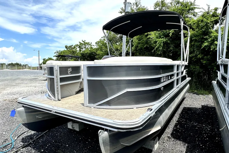 Slide: The Image of 2022 Cypress Cay Seabreeze 232 pontoon boat with canopy, parked outdoors. - 3