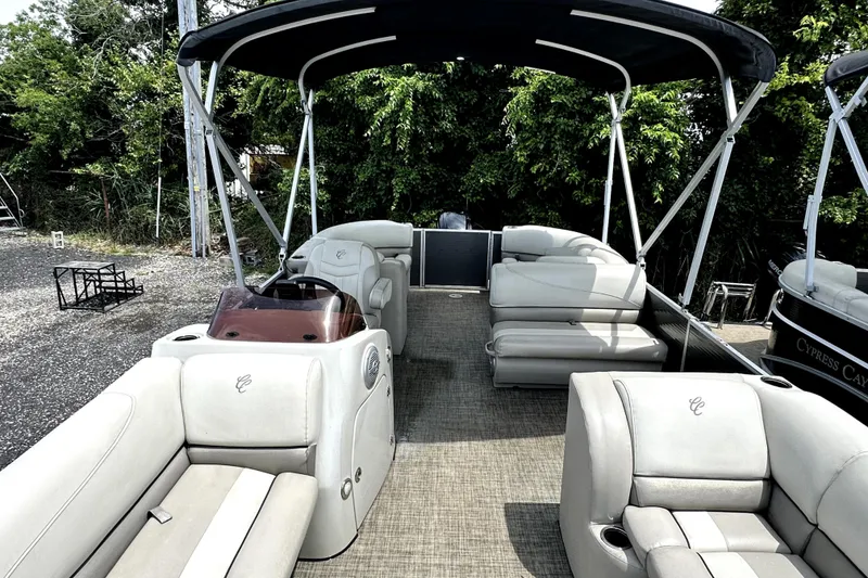 Slide: The Image of 2022 Cypress Cay Seabreeze 232 pontoon boat with spacious seating and canopy. - 5