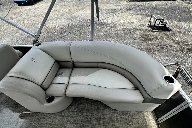 Slide: The Image of 2022 Cypress Cay Seabreeze 232 boat with gray cushioned seating and cup holders. - 7