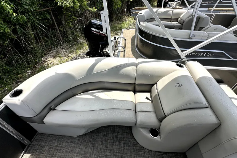 Slide: The Image of 2022 Cypress Cay Seabreeze 232 pontoon boat with comfortable seating and Mercury engine. - 8