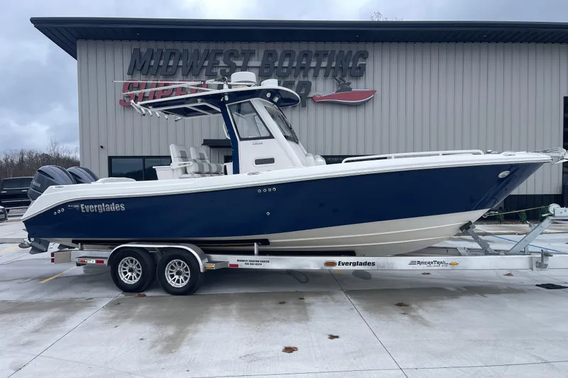 Slide: The Image of 2012 Everglades 295 Center Console boat on trailer at Midwest Boating Center. - 1