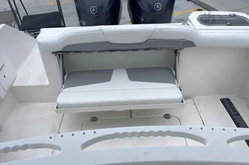 Slide: The Image of 2012 Everglades 295 Center Console boat with foldable seating and dual Yamaha engines. - 13