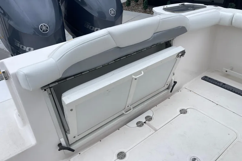 Slide: The Image of 2012 Everglades 295 Center Console boat with foldable seat and dual Yamaha 300 engines. - 14