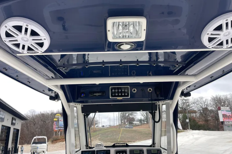 Slide: The Image of Interior view of 2012 Everglades 295 Center Console boat with speakers and control panel. - 18