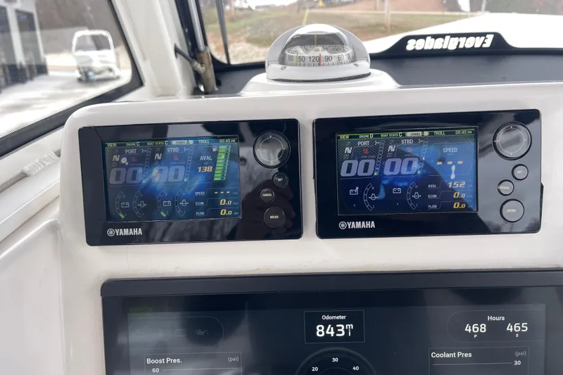 Slide: The Image of Dashboard of a 2012 Everglades 295 Center Console with Yamaha displays and compass. - 23