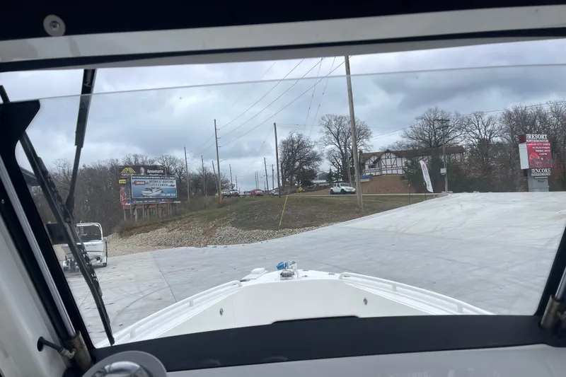 Slide: The Image of View from 2012 Everglades 295 Center Console boat on a cloudy day near a road. - 25