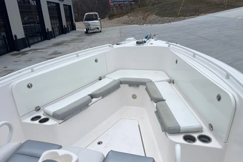 Slide: The Image of 2012 Everglades 295 Center Console boat with spacious seating and cup holders. - 26