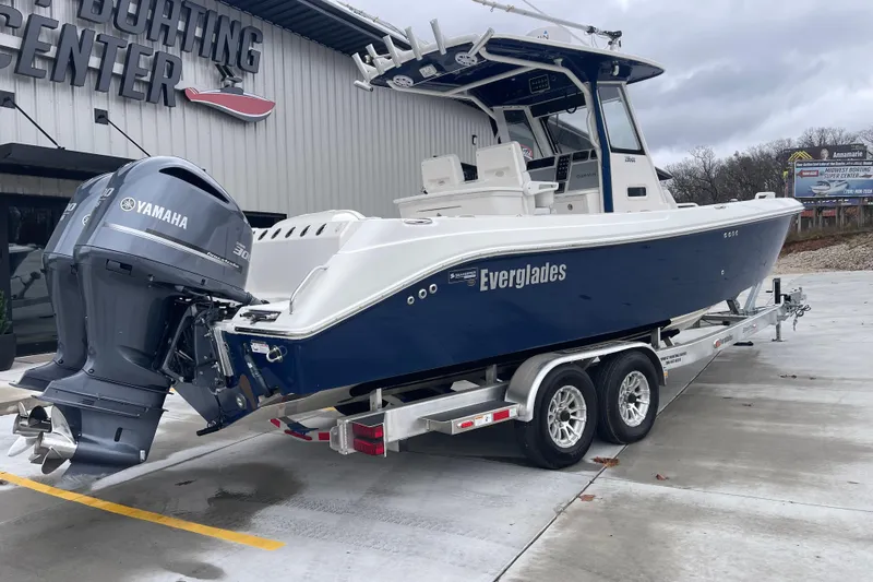 Slide: The Image of 2012 Everglades 295 Center Console boat with Yamaha engine on trailer at boating center. - 3
