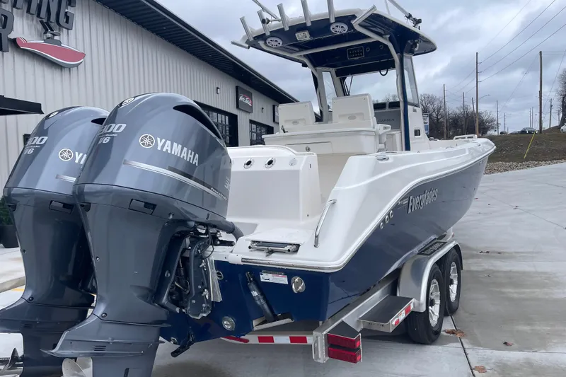 Slide: The Image of 2012 Everglades 295 Center Console boat with twin Yamaha engines on a trailer. - 4