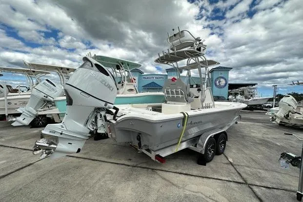Slide: The Image of 2024 Avenger AV26 boat with Suzuki outboard motor on trailer, displayed outdoors. - 3