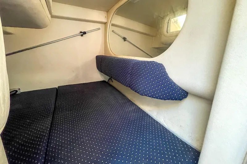 Slide: The Image of Interior cabin of 2000 Sea Ray 260 Sundancer with blue polka dot upholstery. - 26