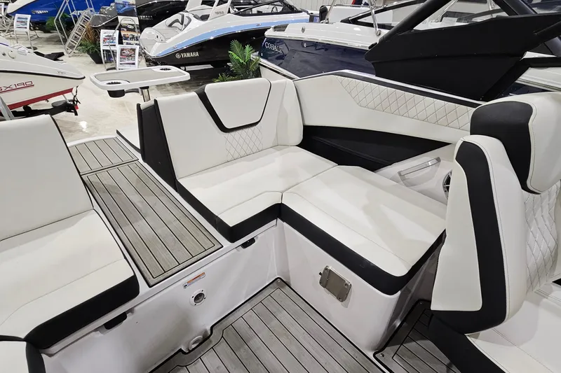 Slide: The Image of 2024 Yamaha Boats 222SE interior with sleek white seating and modern design. - 10