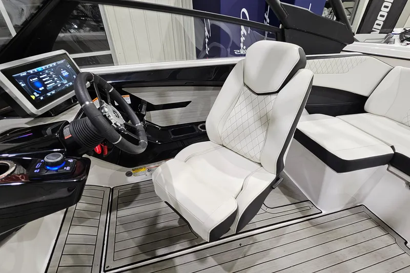 Slide: The Image of 2024 Yamaha Boats 222SE interior with modern dashboard and luxurious seating. - 13