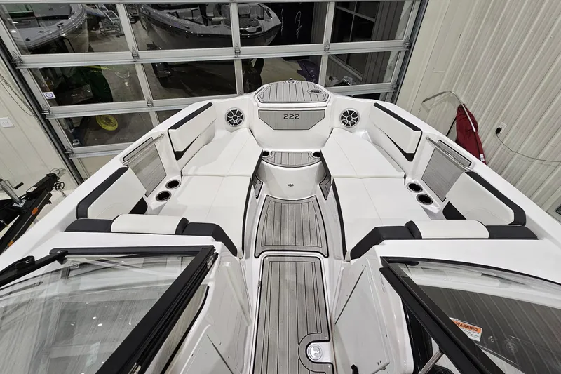 Slide: The Image of 2024 Yamaha Boats 222SE interior, featuring sleek seating and modern design elements. - 16