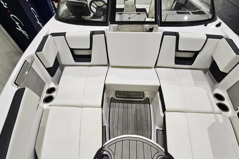 Slide: The Image of 2024 Yamaha Boats 222SE interior with white seating and cup holders. - 19