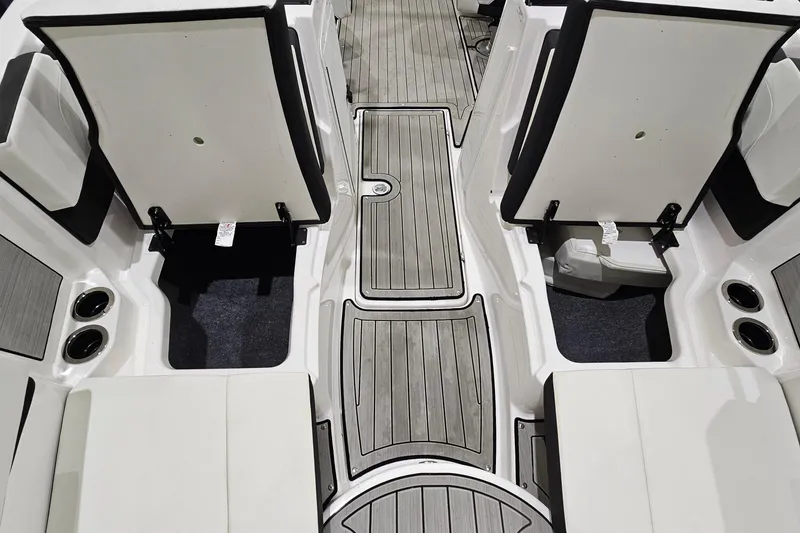 Slide: The Image of 2024 Yamaha Boats 222SE interior with open storage compartments and sleek flooring design. - 21