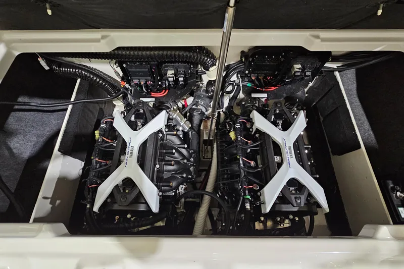 Slide: The Image of 2024 Yamaha Boats 222SE engine compartment showcasing dual engines and wiring. - 23