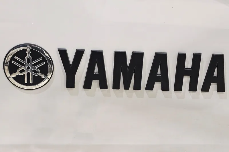 Slide: The Image of Yamaha logo on 2024 Yamaha Boats 222SE, featuring bold black lettering and emblem. - 26