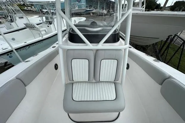 Slide: The Image of 2024 Sea Fox 248 Commander boat interior with cushioned seating and console. - 5