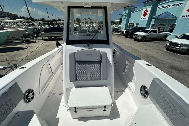Slide: The Image of 2025 Twin Vee 260 GFX2 CC boat interior at Palm City Yachts dealership. - 6