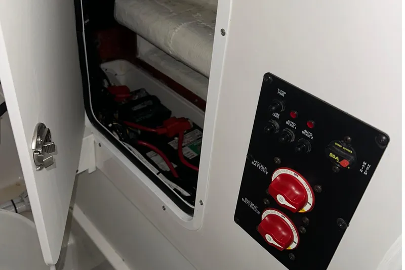 Slide: The Image of 2022 Sea Hunt Gamefish 30 Coffin Box battery compartment and control panel. - 16