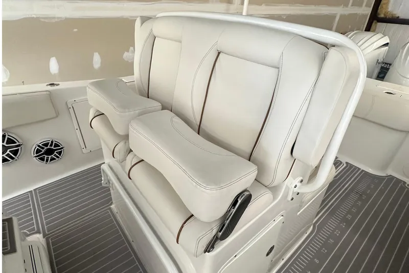 Slide: The Image of 2022 Sea Hunt Gamefish 30 Coffin Box boat with luxurious white seating and armrests. - 21