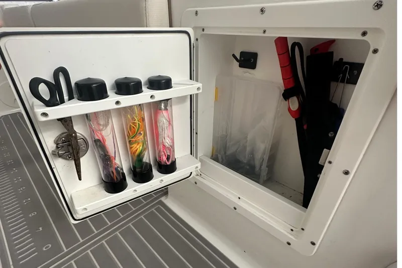 Slide: The Image of Storage compartment on 2022 Sea Hunt Gamefish 30 Coffin Box with fishing gear and tools. - 26