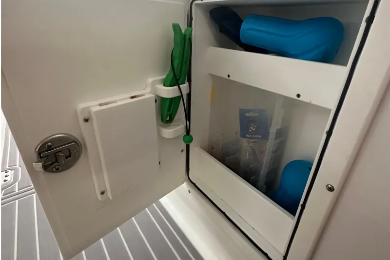 Slide: The Image of 2022 Sea Hunt Gamefish 30 Coffin Box storage compartment with fishing gear and accessories. - 34