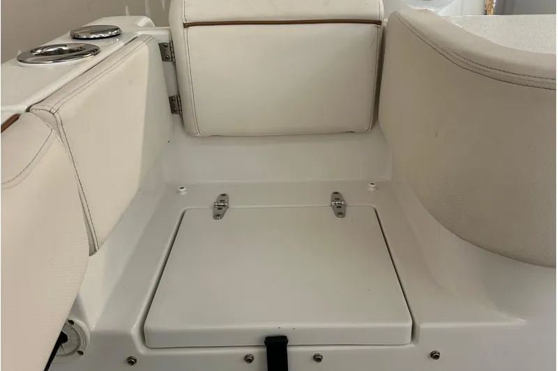Slide: The Image of 2022 Sea Hunt Gamefish 30 Coffin Box interior seating area with storage compartment. - 35
