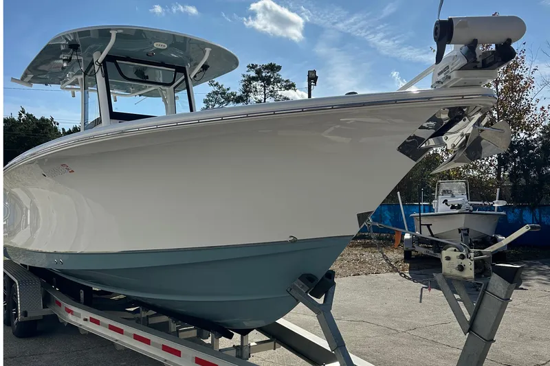 Slide: The Image of 2022 Sea Hunt Gamefish 30 Coffin Box boat on trailer, side view. - 4