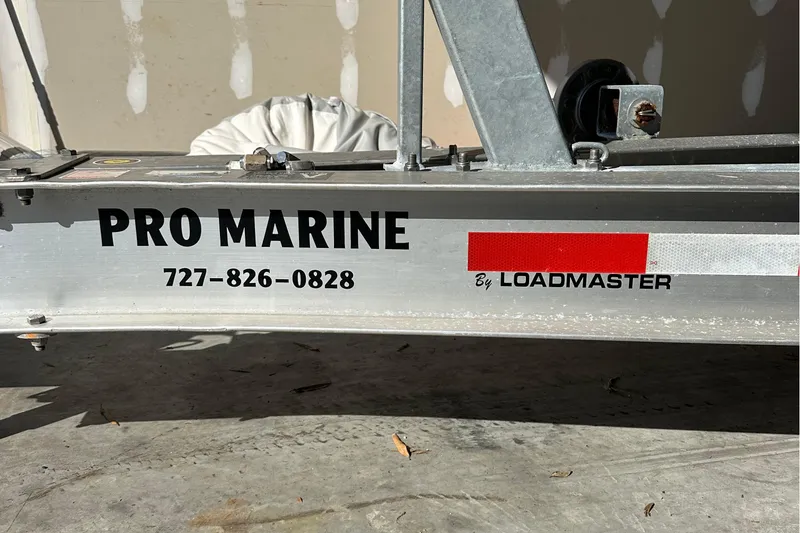 Slide: The Image of Trailer for 2022 Sea Hunt Gamefish 30 Coffin Box by Loadmaster, Pro Marine contact info visible. - 44