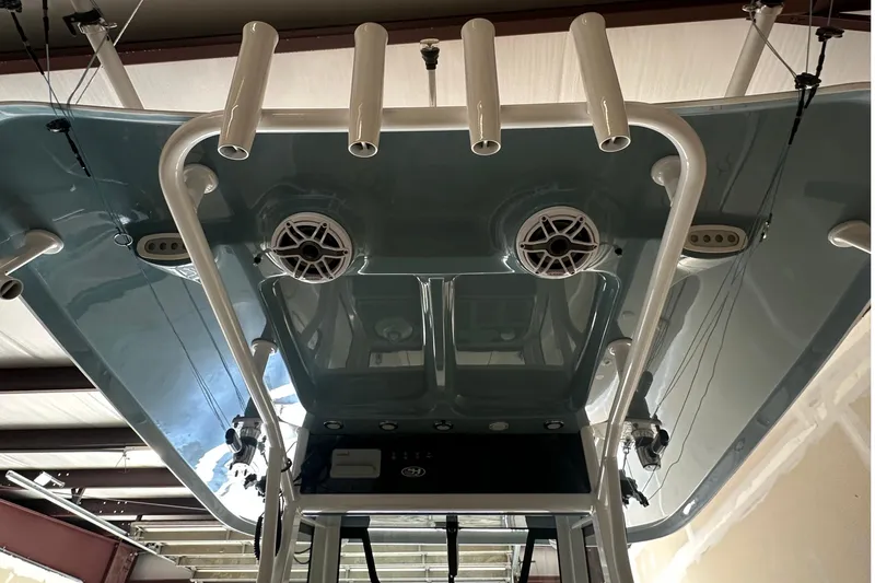 Slide: The Image of 2022 Sea Hunt Gamefish 30 Coffin Box boat, featuring rod holders and speakers. - 45