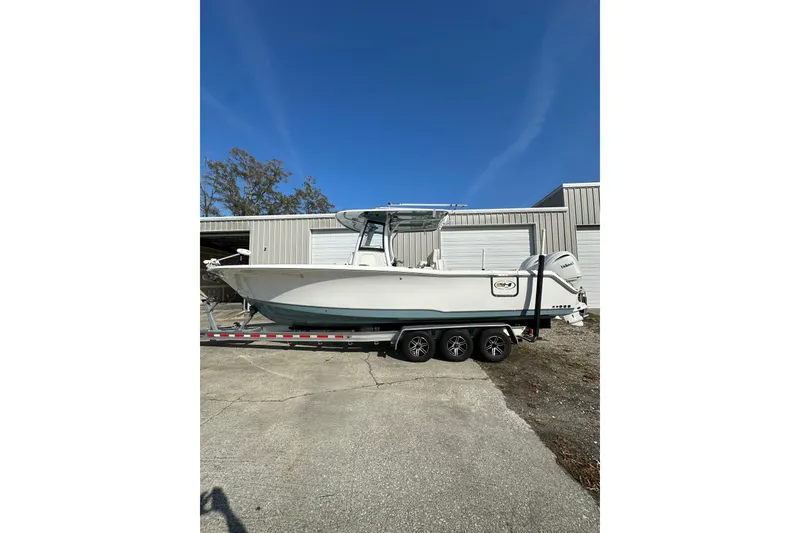 Slide: The Image of 2022 Sea Hunt Gamefish 30 Coffin Box boat on trailer, parked outdoors. - 9