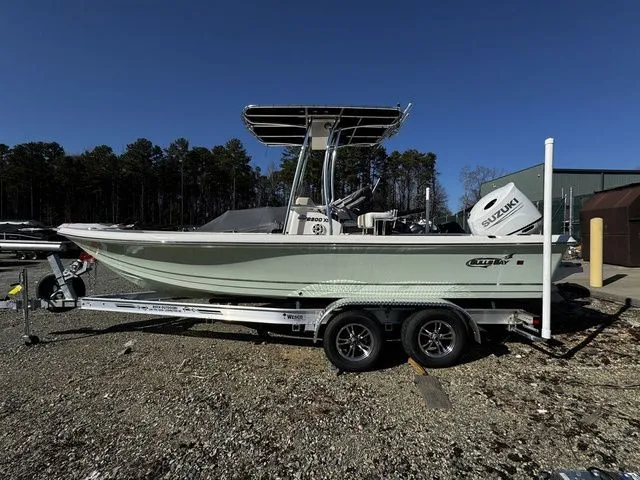 The Image of 2025 Bulls Bay 2200 XS boat on trailer, side view, outdoors, clear sky. - 1