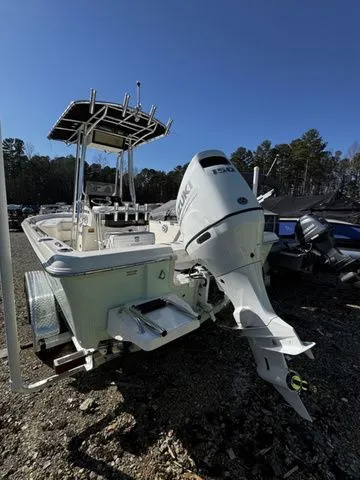 Slide: The Image of 2025 Bulls Bay 2200 XS boat with powerful outboard motor, parked outdoors. - 3