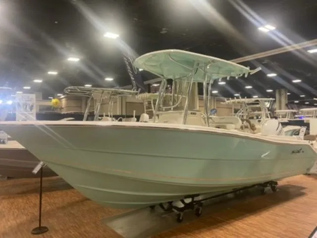 Slide: The Image of 2025 Bulls Bay 230CC boat displayed indoors at a boat show. - 3
