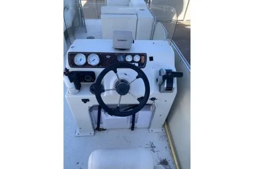 Slide: The Image of 2011 Fiesta 20' Fundeck Classic boat dashboard with steering wheel and controls. - 4