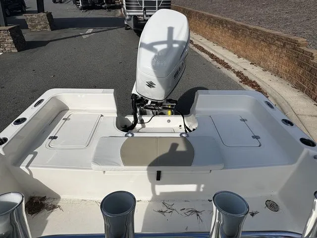 Slide: The Image of 2025 Bulls Bay 2400 boat with Suzuki outboard motor, viewed from the rear deck. - 11