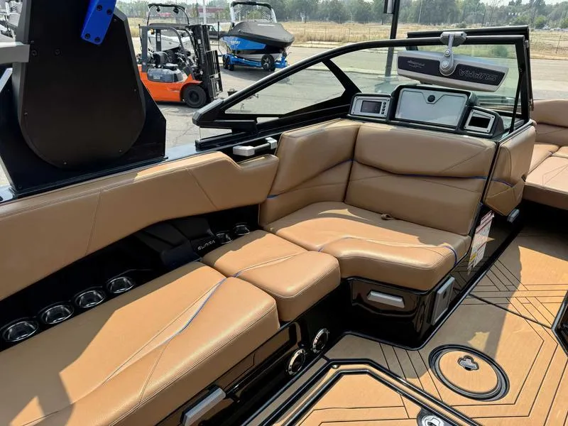 Slide: The Image of 2019 Supra SL450 boat interior with tan leather seating and modern dashboard. - 10