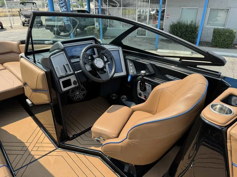 Slide: The Image of 2019 Supra SL450 boat interior with tan leather seats and modern dashboard. - 11