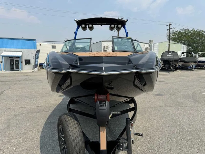 Slide: The Image of 2019 Supra SL450 boat on trailer in outdoor lot. - 4