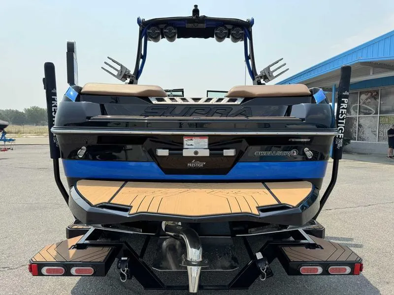 Slide: The Image of 2019 Supra SL450 boat, rear view, showcasing sleek design and modern features. - 6